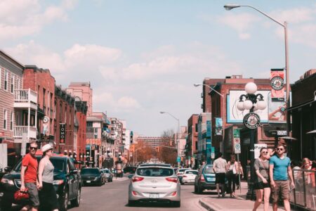 Bustling day in downtown Ottawa captures pedestrians, historic buildings, and lively street life.