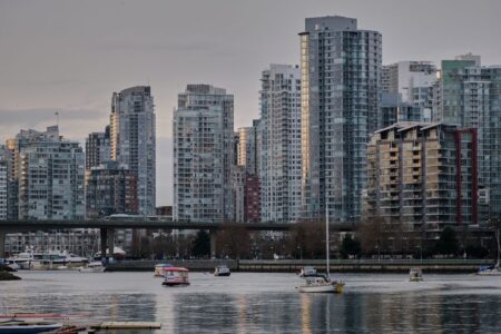View of Vancouver's skyline featuring modern skyscrapers and boats on the water.
